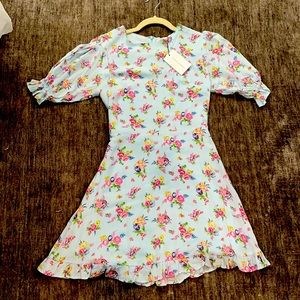 Floral mini dress by Faithful the Brand.